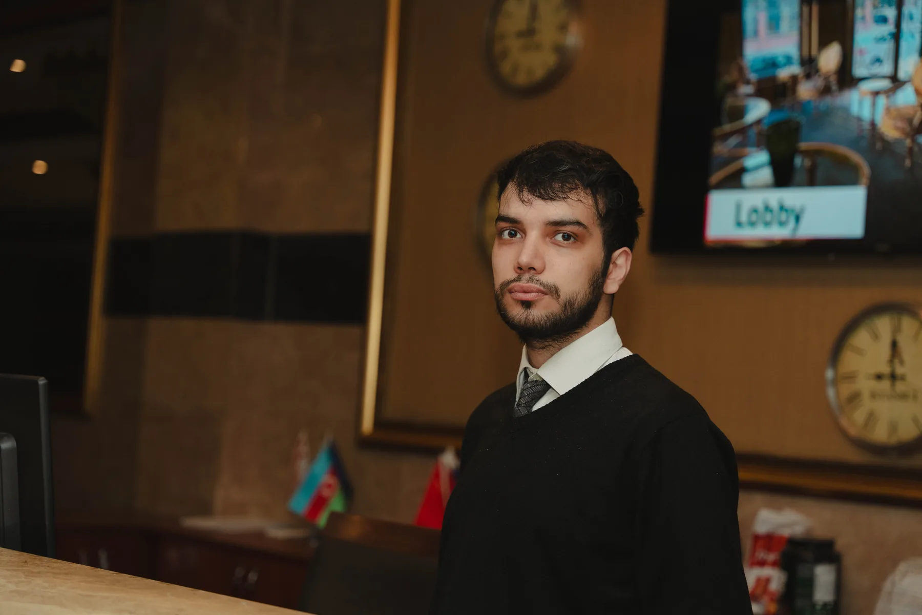 Hotel receptionist working at a front desk